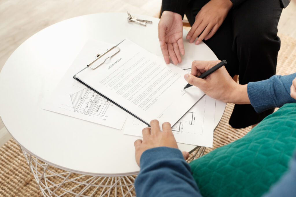 Home owner signing a contractor agreement