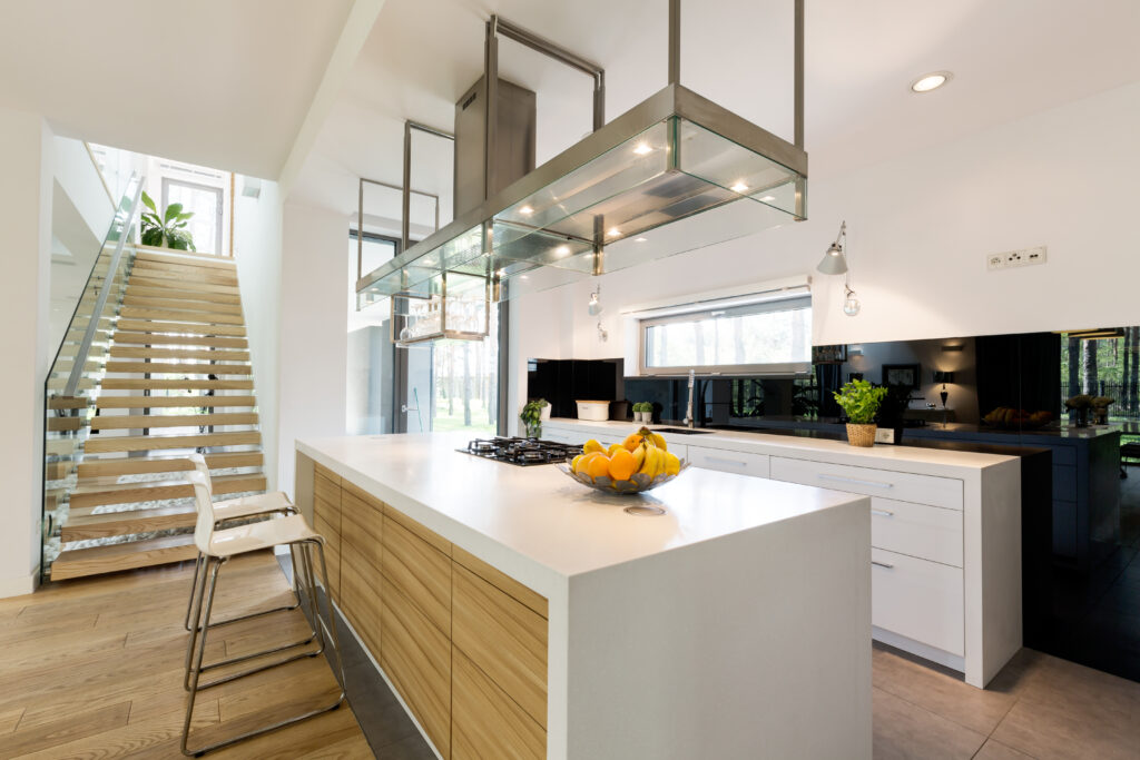 Modern open plan kitchen area with wooden and metal detail